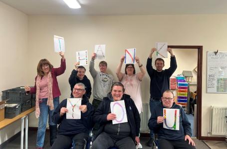 ECO Workshop particpants holding up letters to spell Thank You