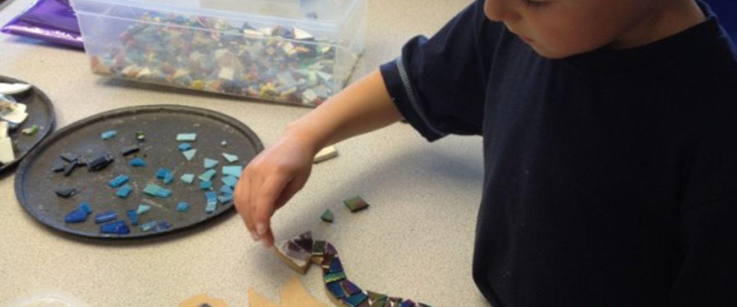 child making a mosaic