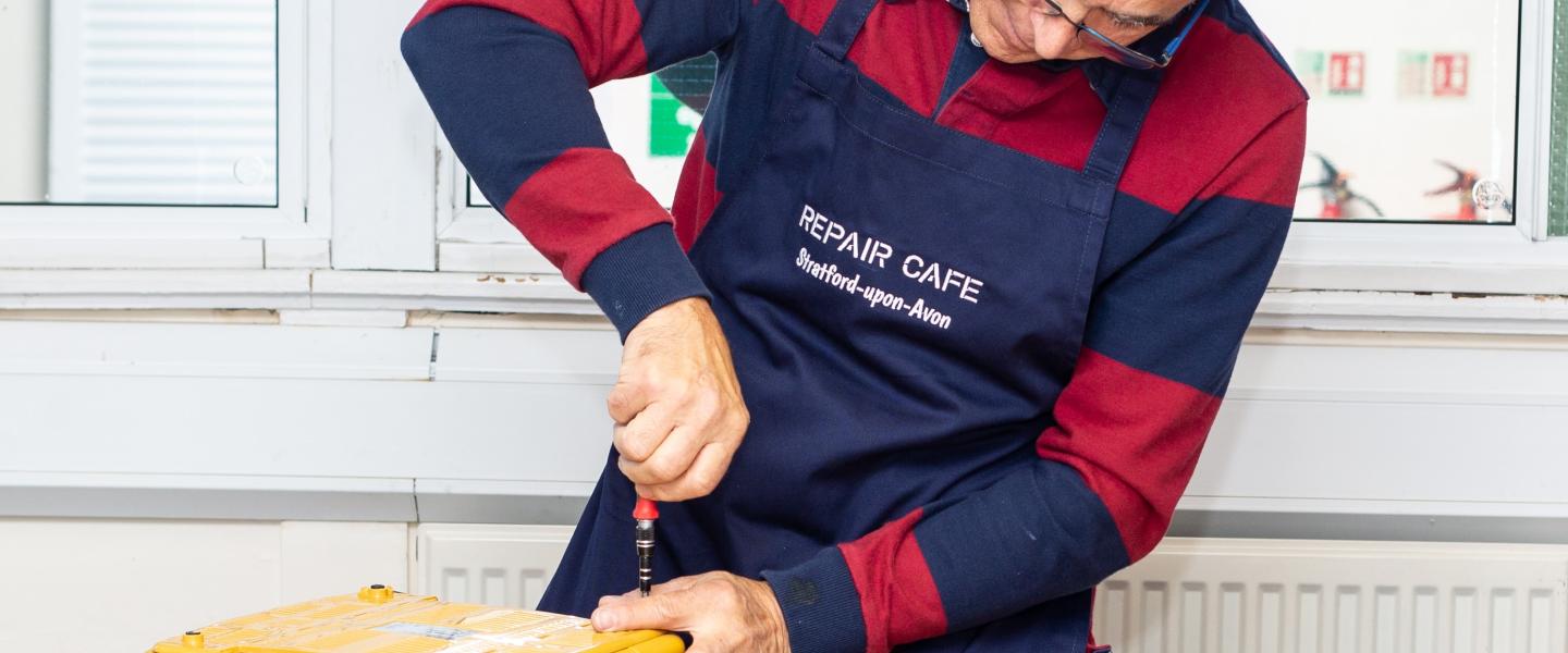 Volunteer repairing a toaster