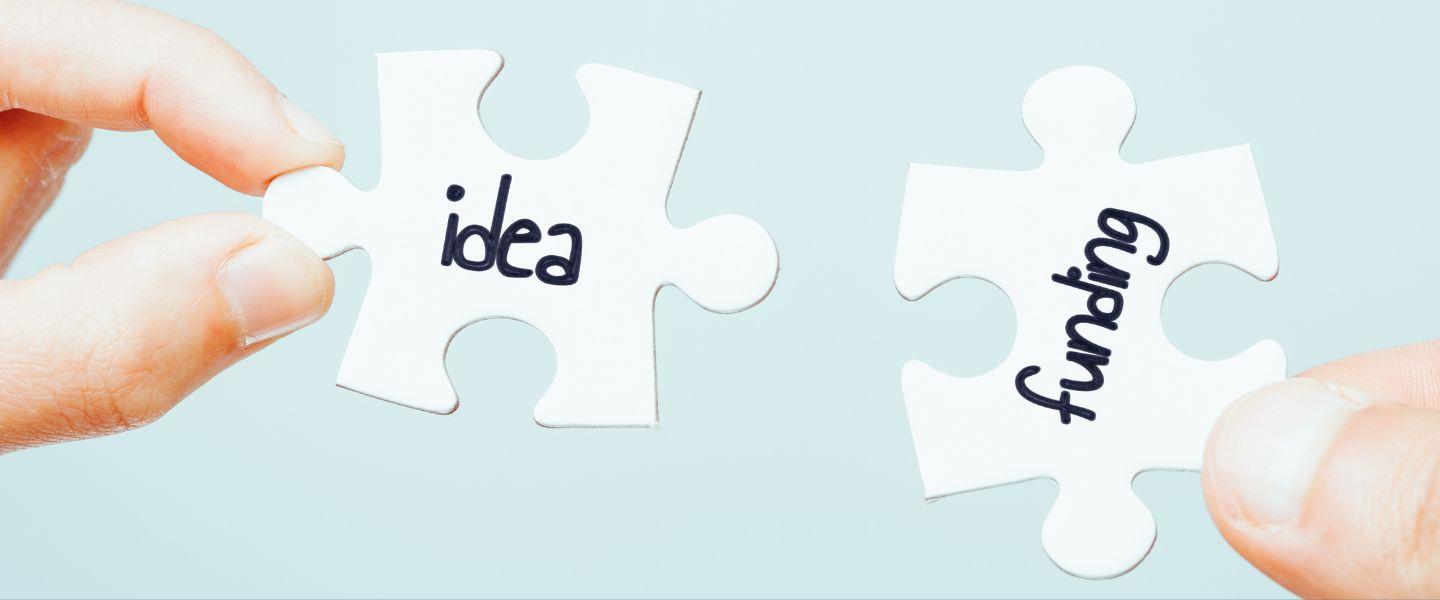 a jigsaw with idea and funding written on the pieces